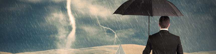 Brumbaugh Insurance Man with umbrella in a storm
